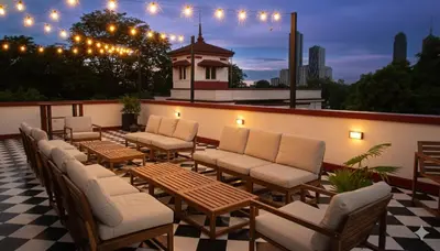 a row of chairs and tables on a patio at MiraNamin Nest GUMAMELA - Family Suite in Historic Home with Indoor Plunge Pool, Garden View, Pet-Friendly, Self-Service Breakfast in Manila
