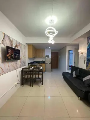 a living room with a couch and a table at 4kys staycation in Manila