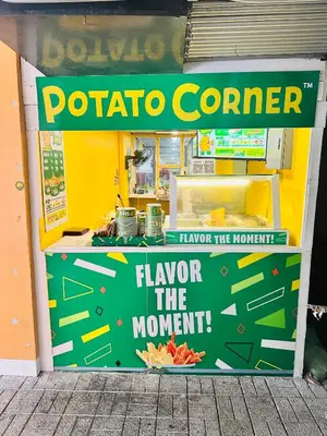 a store with a sign for a potato corner at We Vibe, Azure Urban Resort Residences in Manila