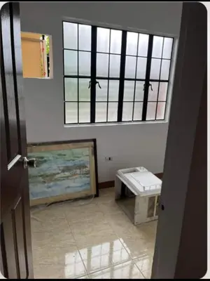 a room with a window and a bench in it at Laureano di trevi tower 2 Condominium Corporation in Manila