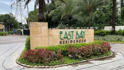 a sign for the east bay receivables at Chelsea Tower 3 in Manila
