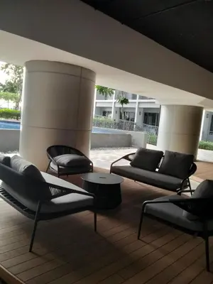 a group of chairs and tables on a deck at Shore2 tower2 11th floor, unit 1122 VSV Luxury Family Suite staycation Moa in Manila