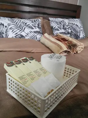 a tray with toilet paper and towels on a bed at Shore2 tower2 11th floor, unit 1122 VSV Luxury Family Suite staycation Moa in Manila