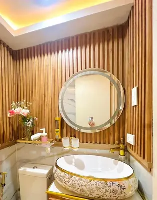 a bathroom with a tub and a large mirror at Paris Hilton Beach resort in Manila