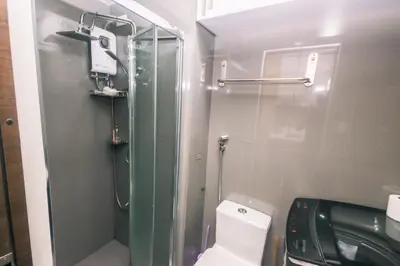 a bathroom with a glass shower and a toilet at Hidden Gem Coolest Crash spot Makati Swim Gym Park 2320 in Manila