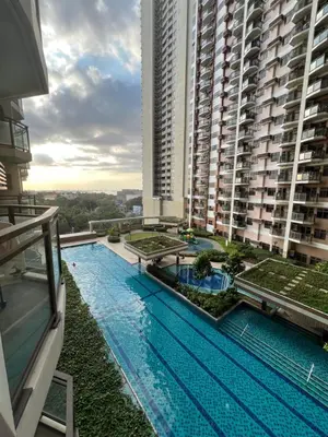 a large swimming pool on top of a building at Radiance Manila Bay in Manila