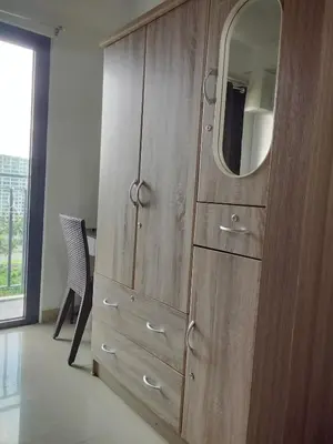 a wooden cabinet with a mirror on top of it at VSV Luxury Family Suite staycation Moa shore2 tower2 unit1122 in Manila