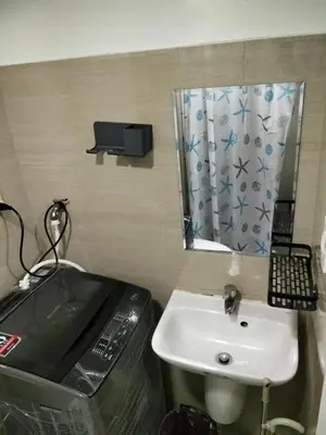 a bathroom with a sink and a mirror at VSV Luxury Family Suite staycation Moa shore2 tower2 unit1122 in Manila