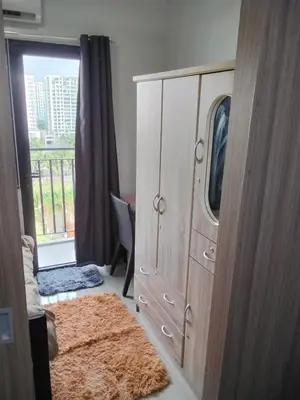 a bedroom with a large dresser and a window at VSV Luxury Family Suite staycation Moa shore2 tower2 unit 1122 in Manila