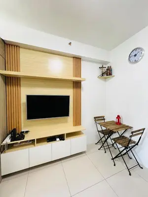 a living room with a flat screen tv on a wall at D Crib at Breeze Residences Pasay City Philippines in Manila