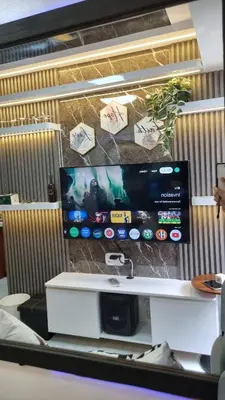 a large screen tv on a wall in an office at The Villa Staycation at La Verti Residences in Manila