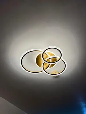 a gold and white sign on a wall at Sea Residences MOA Pasay City- Kirk in Manila