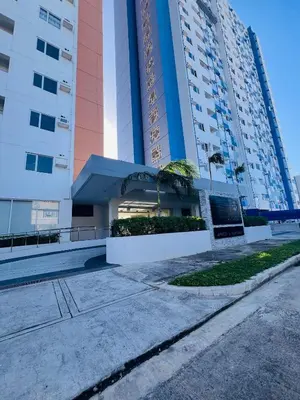 an empty street in front of a tall building at Tulip Garden Condominium Southwoods in Biñan