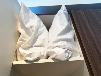 a box with some white sheets in it at Elegant 1 bedroom apartment with great facilities and perfect location in Manila