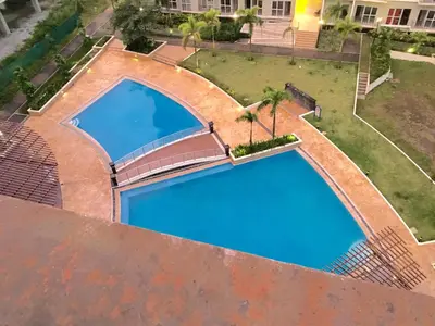 an overhead view of a swimming pool on a roof at Mondavi II Condo Unit 306 in Silang