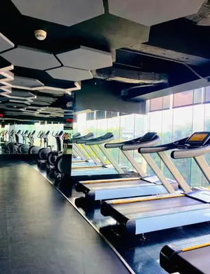 a row of rows of treadmills in a gym at Studio unit at The Milano Residences in Manila