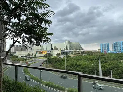 a view of a city with a road and buildings at 1BR 2 mins to Okada near MOA & Airport-12C in Manila