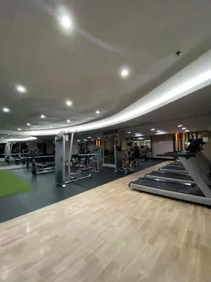 a gym with a bunch of treadmills and machines at Great Price and Location in Moa, Pasay City, Philippines in Manila