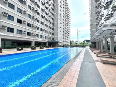 a swimming pool in the middle of a building at 2019 Cavite Green 2 Condo Amenities HI Speed Wifi in Dasmariñas