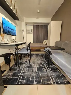 a living room with a couch and a table at 2019 Cavite Green 2 Condo Amenities HI Speed Wifi in Dasmariñas