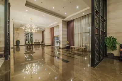 a lobby of a building with a chandelier at 1Br Suite w Balcony in Pasay - The Radiance Manila Bay in Manila