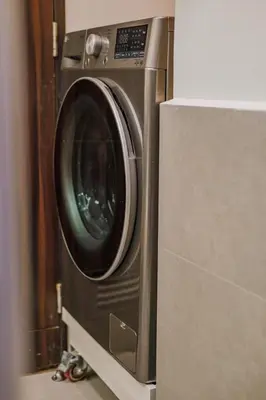 a washing machine sitting on top of a counter at 1Br Suite w Balcony in Pasay - The Radiance Manila Bay in Manila