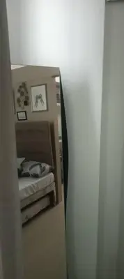 a mirror reflection of a bedroom with a bed in it at CHIC ROOM pasay sea residence in Manila