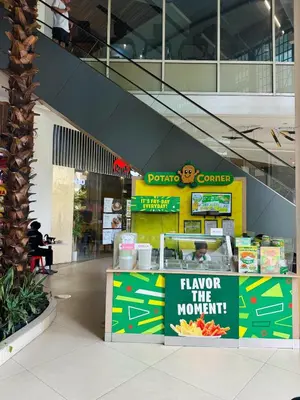 a store with a sign that says flavor the moment at Sleek & Chic One-Bedroom in Manila