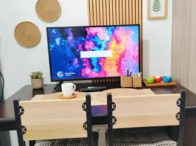 a television sitting on top of a desk at Mall of Asia Accommodation in Manila