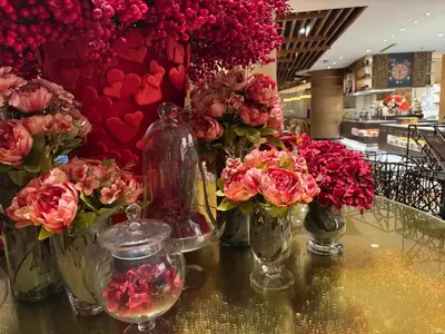 a group of vases filled with flowers on a table at Large Family Groups in Air residence Makati Gym Swim Park 300 mbps in Manila