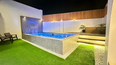 a hot tub in a room with green grass at Cozy Private Resort with Pool, Hijas Villa Binangonan in Binangonan