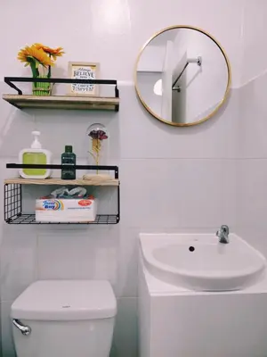 a bathroom with a sink and a mirror on the wall at Aki's Place Binangonan in Binangonan