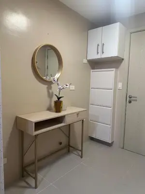 a dressing table with a mirror on the wall at Modern & Cozy Two BR in Jazz Residences Makati City in Manila