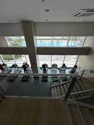 a group of people sitting in chairs in a building at Quaint Roces Studio in Manila