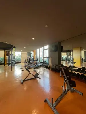 a gym with a row of exercise bikes in a room at Radiance manila bay in Manila