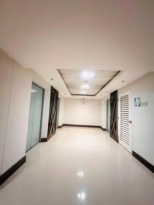 an empty room with white walls and a ceiling at Sea Residence MOA - Paul Condotel in Manila