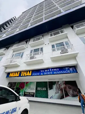 a white building with a sign in front of it at Sea Residence MOA - Paul Condotel in Manila
