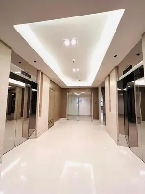 a hallway of a building with a white floor at Sea Residence MOA - Paul Condotel in Manila