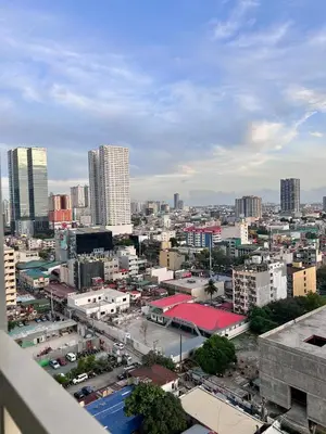 a view of a city with tall buildings at Coasis at SMDC Coast Residences in Manila