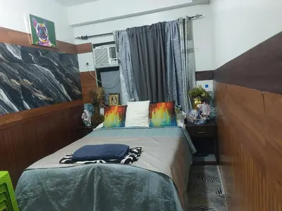 a bedroom with a bed and a window at Bellflower florida sun in General Trias