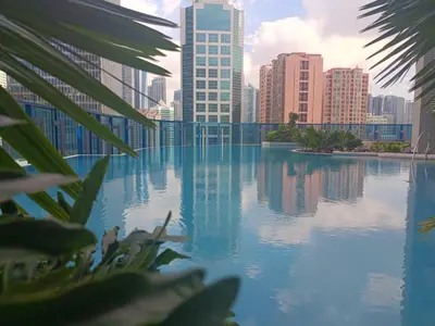 a view of a city skyline with tall buildings at Crisean Highrise Condo - 100 West makati in Manila