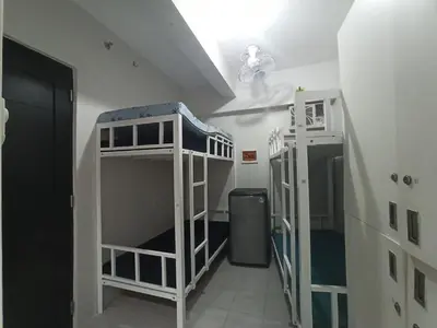 two bunk beds in a room with a hallway at City Space in Manila