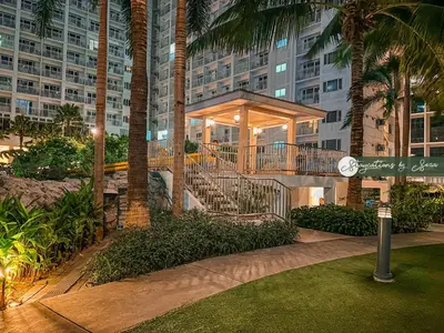 a building with a staircase in front of a building at Shore Residences 2 Bedroom Near NAIA Airport and MOA in Manila