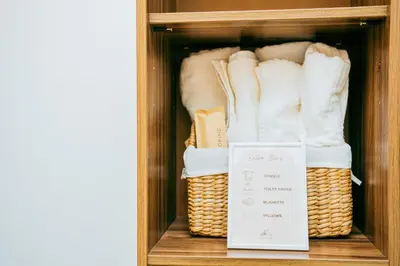 a cabinet with two baskets and a sign in it at Love, Lourdes Villa in Imus