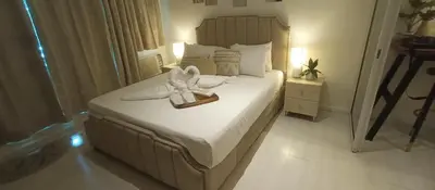 a bedroom with a bed with towels on it at Casa Crisav Staycation place at AZURE in Manila
