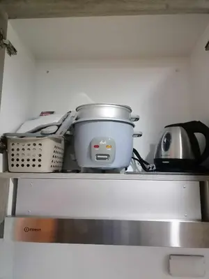 a pot sitting on top of a shelf in a kitchen at Gorgeous 1BR Condo Unit near MOA and Manila Int'l Airport in Manila