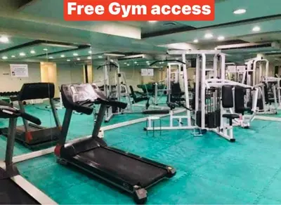 a gym with several treadmills and machines in it at Birch Tower a4 front of Robinson Mla FREEpool in Manila