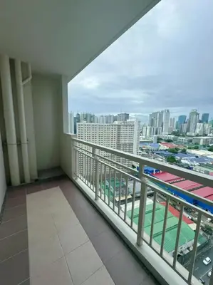 a balcony with a view of a city at Brixton Place in Manila