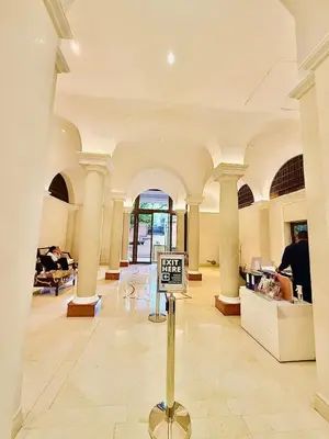 a lobby with a sign in the middle of a room at Admiral Baysuites 2823 in Manila