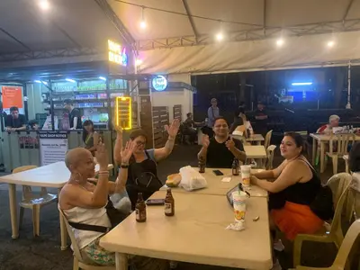 a group of people sitting at a table at All Access Manila Tour in Manila